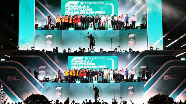 Drivers and team principals wave to the crowd at the Miami Grand Prix opening ceremony