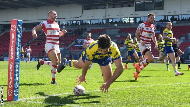 Jake Mamo scores for Warrington against Leigh