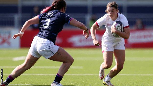 Helena Rowland runs with the ball