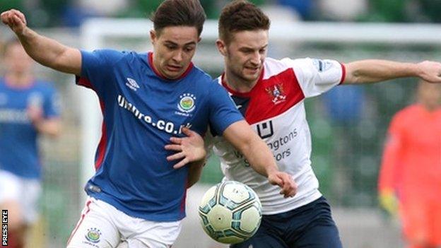 Jordan Stewart and David McAllister battle for the ball in Linfield's win over Ards on Saturday