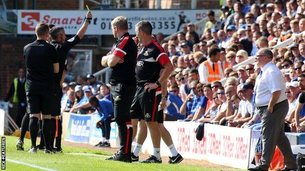 Steve Evans shown a second yellow card on touchline for Peterborough v Doncaster