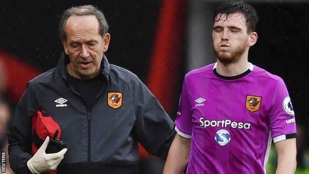 Hull City left-back Andrew Robertson is led off against Bournemouth