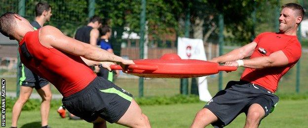 Rhys Priestland and Hallam Amos tussle in training