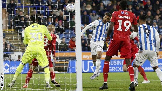 Steve Mounie powers in Huddersfield's second goal