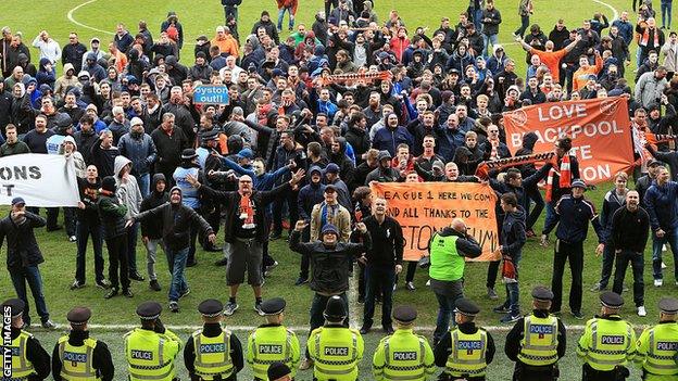 Blackpool fans invade the pitch on the final day of the 2014-15 Championship campaign