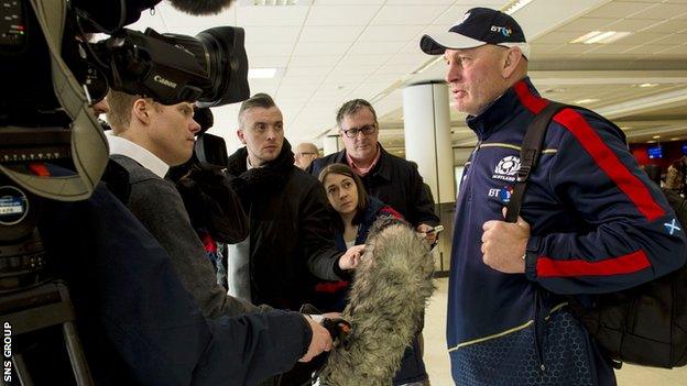 Vern Cotter talks to reporters at Edinburgh Airport