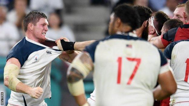 The England players (in red) react angrily to the high tackle by Quill