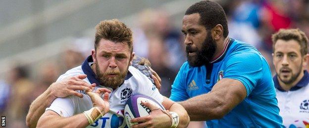 Samuela Vunisa of Italy tackles Scotland's Ryan Wilson