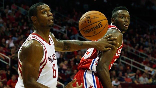 Terrence Jones of the Houston Rockets battles for the basketball with Jerami Grant of the Philadelphia 76ers