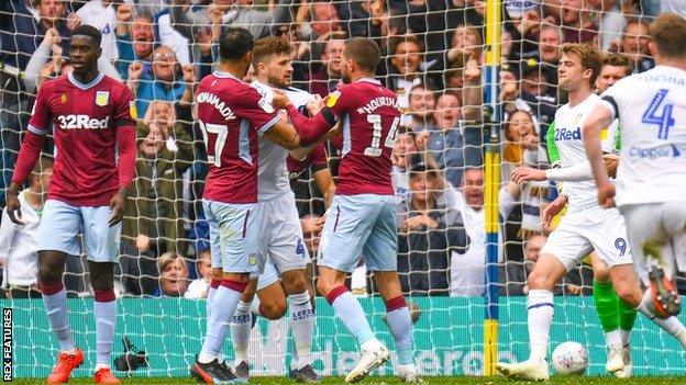 Villa players grabbed hold of Mateusz Klich following his controversial opening goal at Elland Road