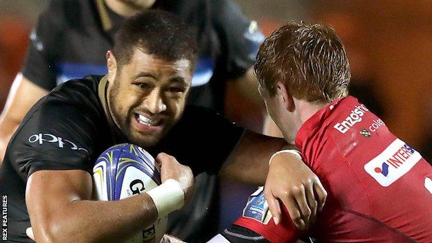 Bath's Wales number eight Taulupe Faletau takes on Rhys Patchell