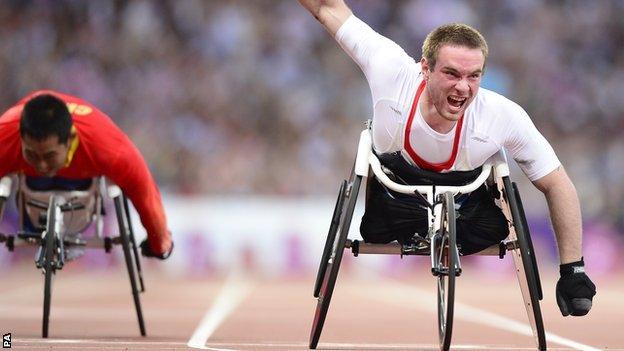 Mickey Bushell celebrates after taking the gold medal in the men's 100m T53 at the London Paralympics in 2012