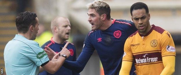 Andrew Dallas is confronted by Hearts and Motherwell players