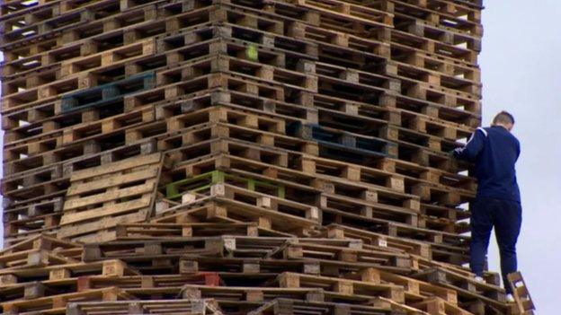 Youth helping to build bonfire near Belfast city centre