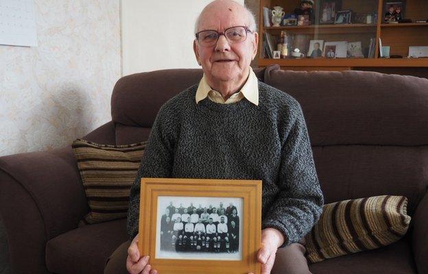 Robert Thomson with a photo of Clyde's 1939 Scottish Cup-winning squad