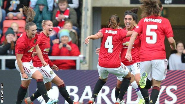 Jess Sigsworth (second from right) celebrates scoring Manchester United's second goal in the victory over their derby rivals