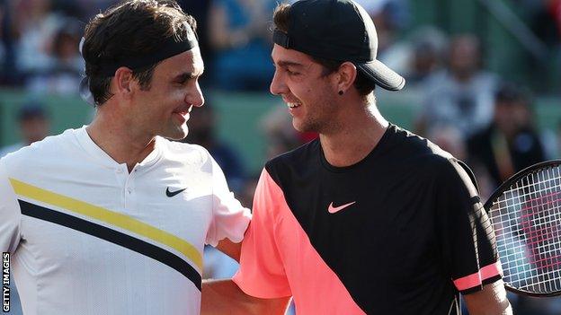 Kokkinakis (right) beats Federer