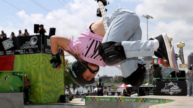 Skateboarder Sky Brown doing a flip