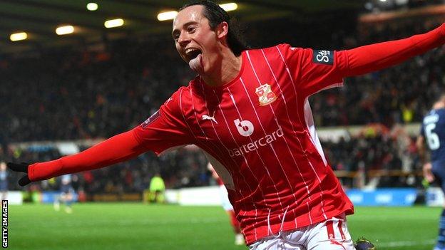 Swindon Town striker Harry McKirdy celebrates his goal against Manchester City