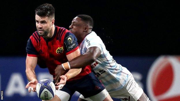 Conor Murray is tackled by Racing try-scorer Yannick Nyanga during the first half