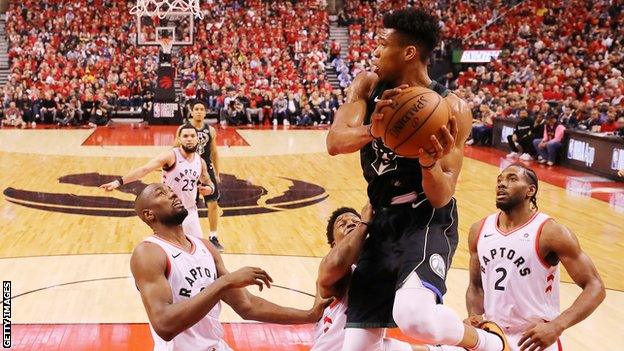 Giannis Antetokounmpo in action for Bucks v Raptors