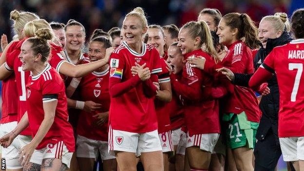 Wales players celebrate the goalless draw which took them a step closer to a first major tournament appearance