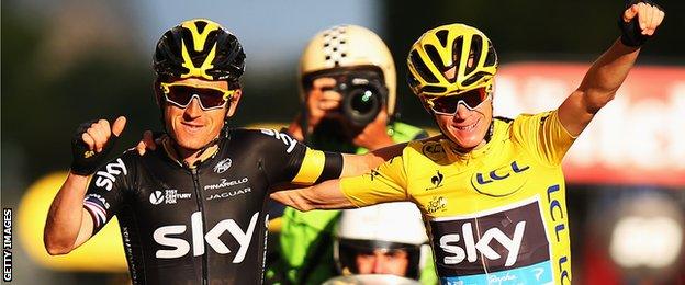 Chris Froome and Geraint Thomas celebrates as Froome nears the end of the final stage of the 2015 Tour de France