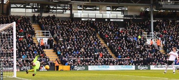 Brighton & Howe Albion goalkeeper David Stockdale saves Fulham Stefan Johansen's penalty