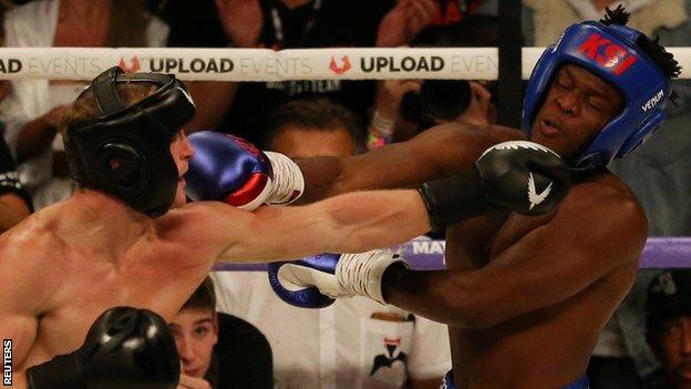 Logan Paul (left) and KSI (right) in action during Saturday's fight at Manchester Arena