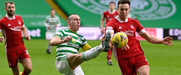 Scott Brown vies for possession with Aberdeen's Andrew Considine