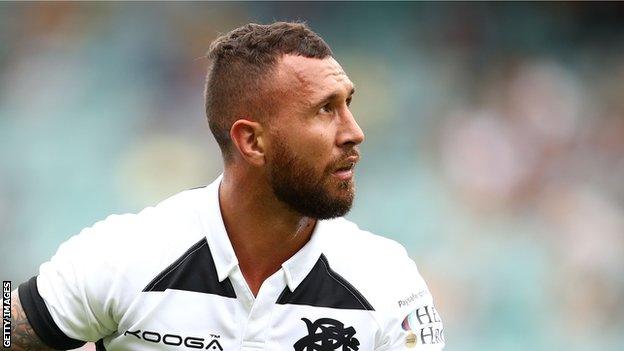 Quade Cooper watches as a kick heads for the posts while playing for Barbarians