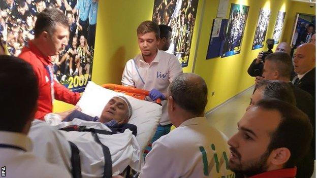 Besiktas head coach Senol Gunes receiving medical treatment at a hospital