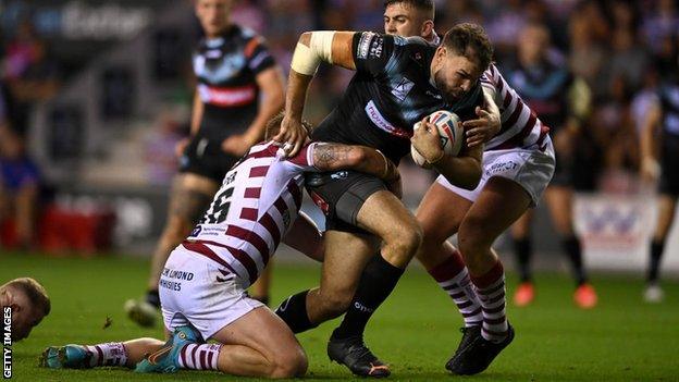 Alex Walmsley playing for St Helens against Wigan Warriors