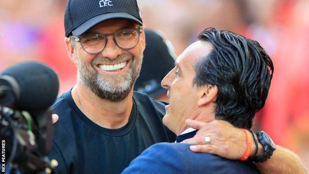 Unai Emery and Jurgen Klopp embrace at Anfield