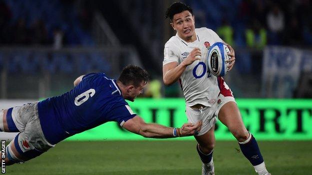 Marcus Smith runs round an Italy tackle