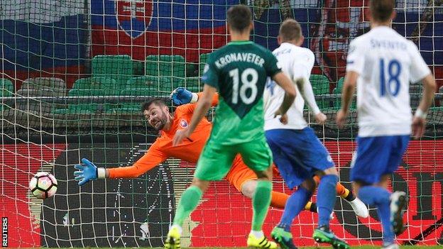 Slovenia's Rok Kronaveter scores against Slovakia