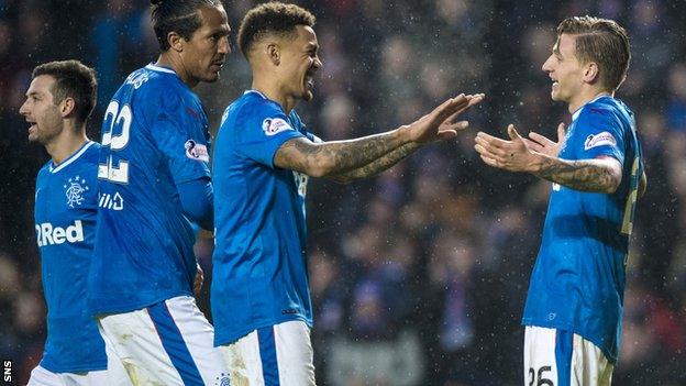 Rangers striker Jason Cummings (right) celebrates his hat-trick