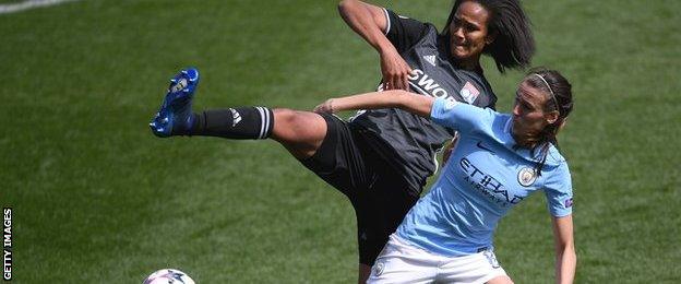 Jill Scott and Wendie Renard challenge for the ball