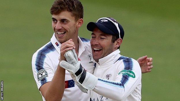 Andy Hodd (right) celebrates Yorkshire taking a wicket