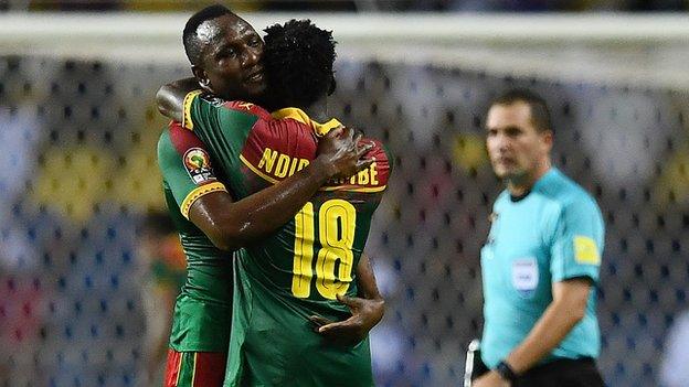 Vincent Aboubakar and Robert Ndip Tambe celebrate after Cameroon sealed a quarter-finals spot