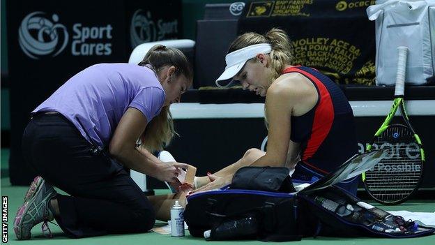 Caroline Wozniacki receives medical attention