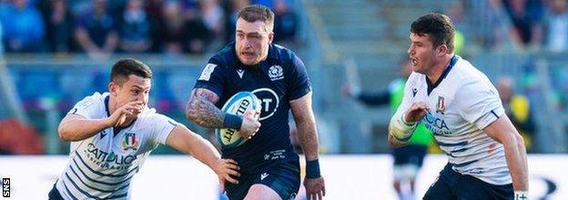 Scotland captain Stuart Hogg on his way to a try against Italy