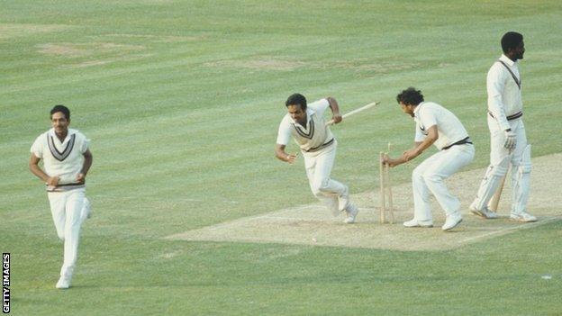 Victorious India players Yaspal Sharma and Roger Binny grab souvenir stumps after winning the 1983 cricket World Cup against the West Indies