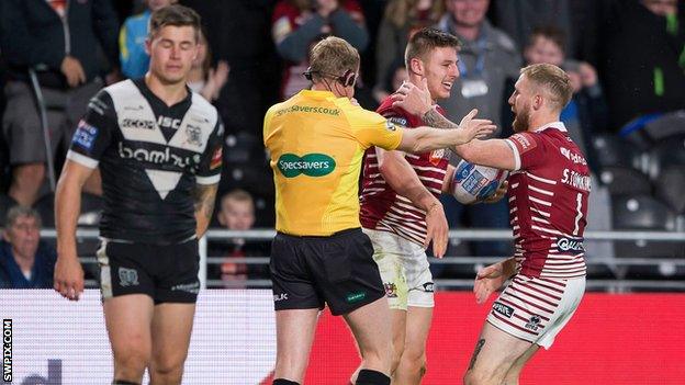 Wigan celebrate Tom Davies' try