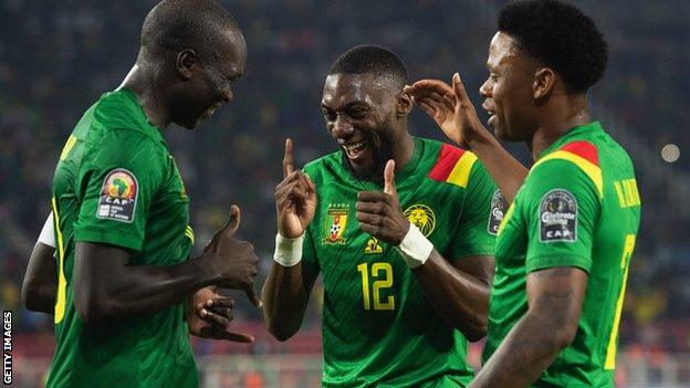 Cameroon players celebrate a goal