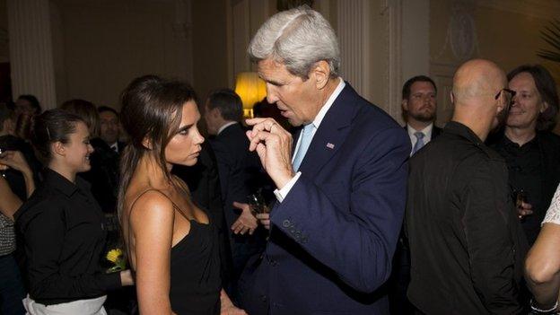 US Secretary of State John Kerry speaks with British designer Victoria Beckham