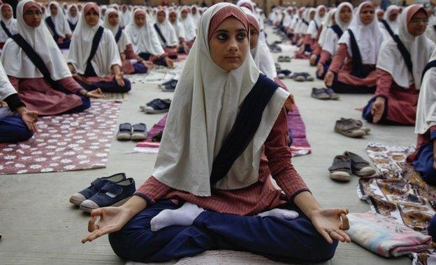 Indian Muslim students practice yoga at a school ahead of first International Yoga Day in Ahmadabad, India, Wednesday, June 17, 2015