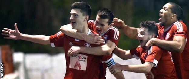 Stuart McMullan celebrates after putting Larne ahead at Inver Park