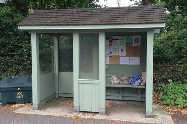 Bus stop with teddies