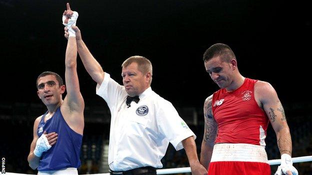 Azerbaijan's Albert Selimov is declared the winner of the Olympic lightweight bout against Ireland's David Oliver Joyce